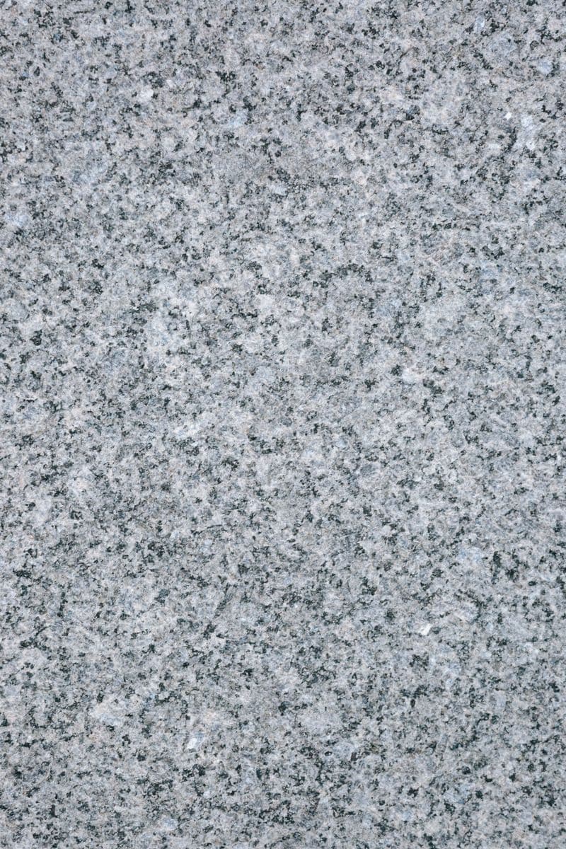 Close-up of speckled gray granite with a flamed finish