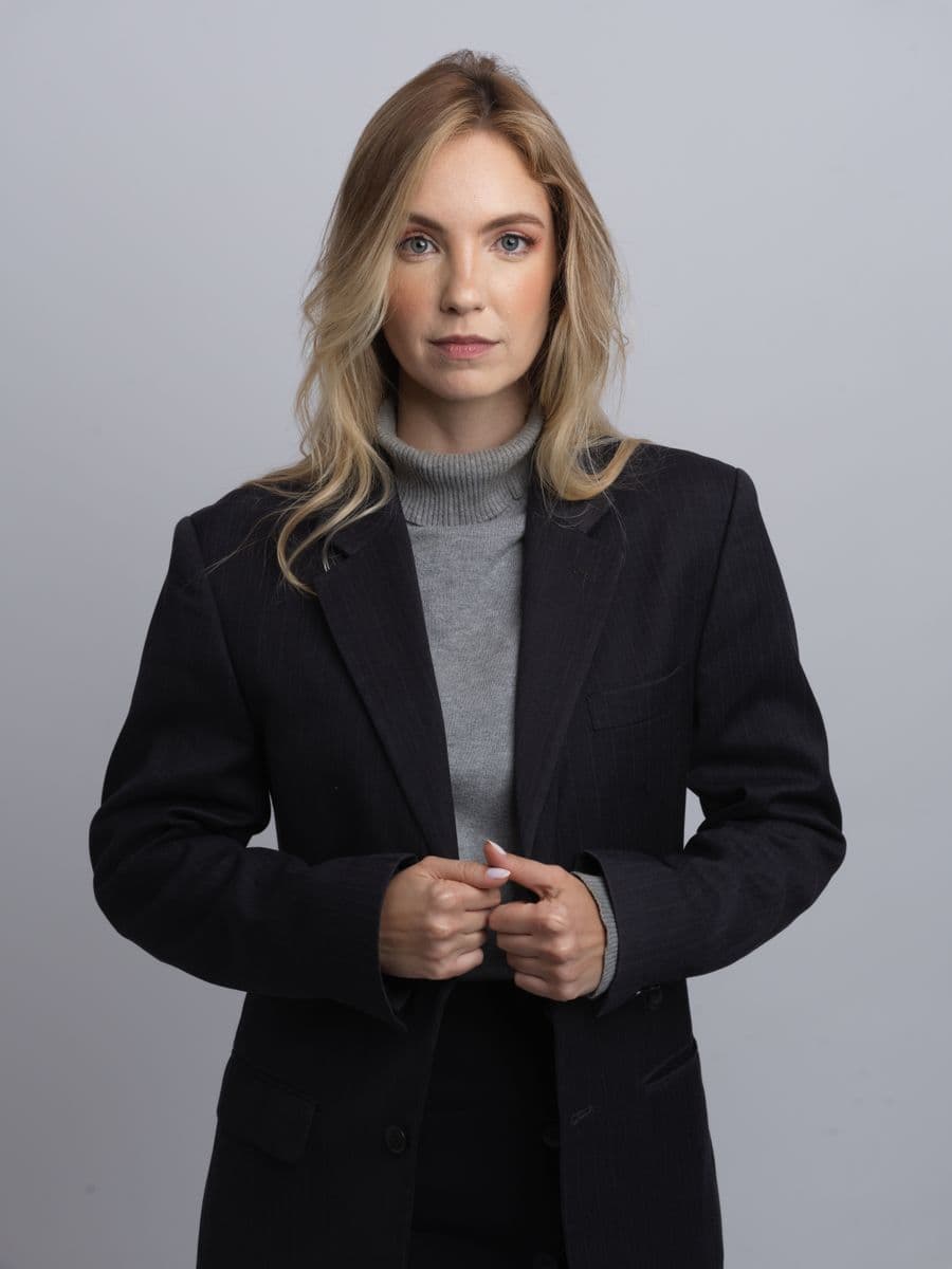 Portrait of Eleanor Whitcomb in a dark blazer