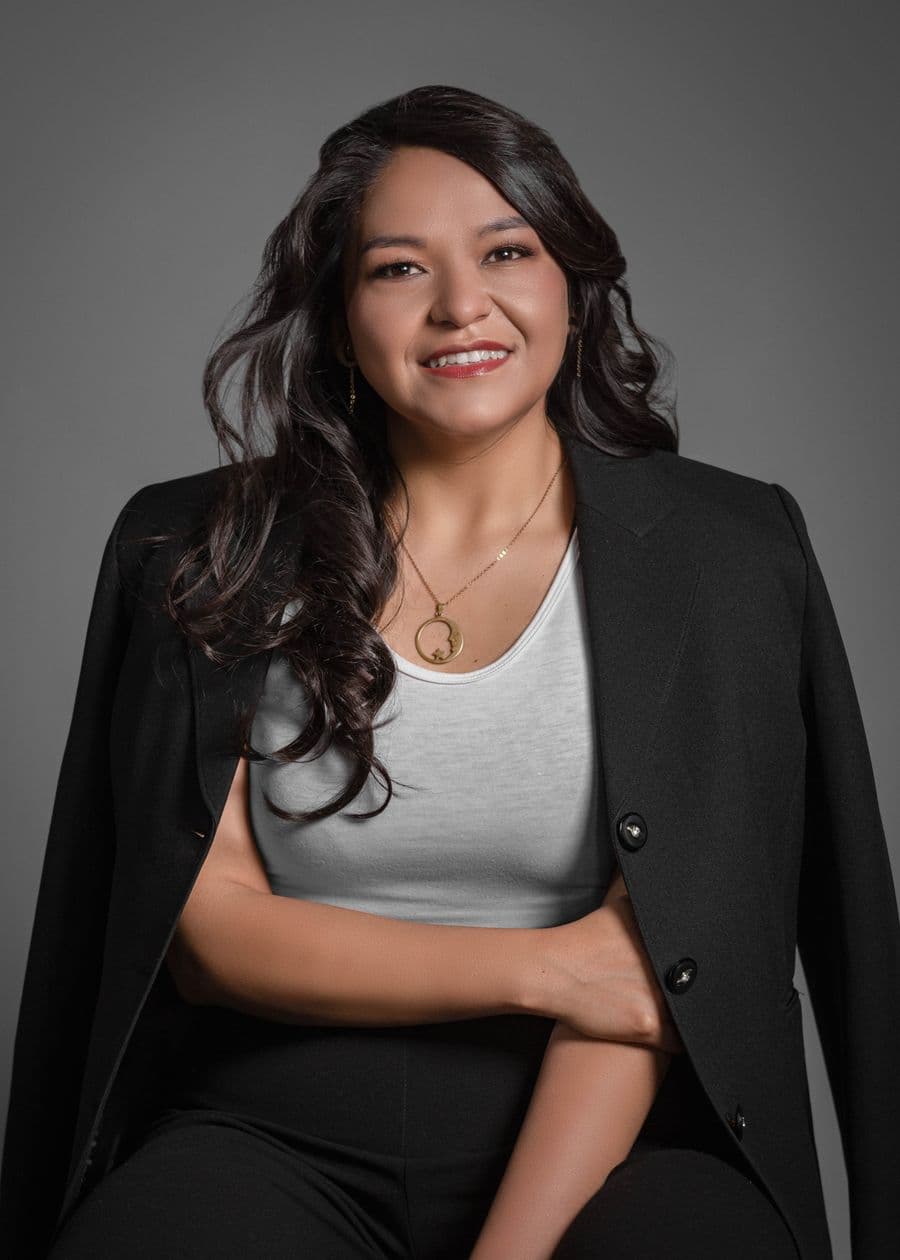 Portrait of Sofia Alvarez, smiling, in a black blazer
