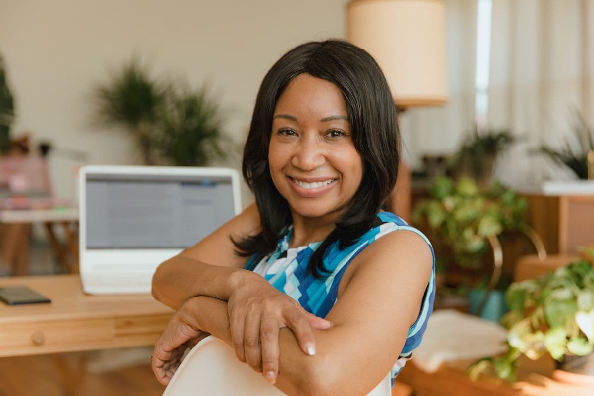 Portrait of Monica Hayes smiling at her desk